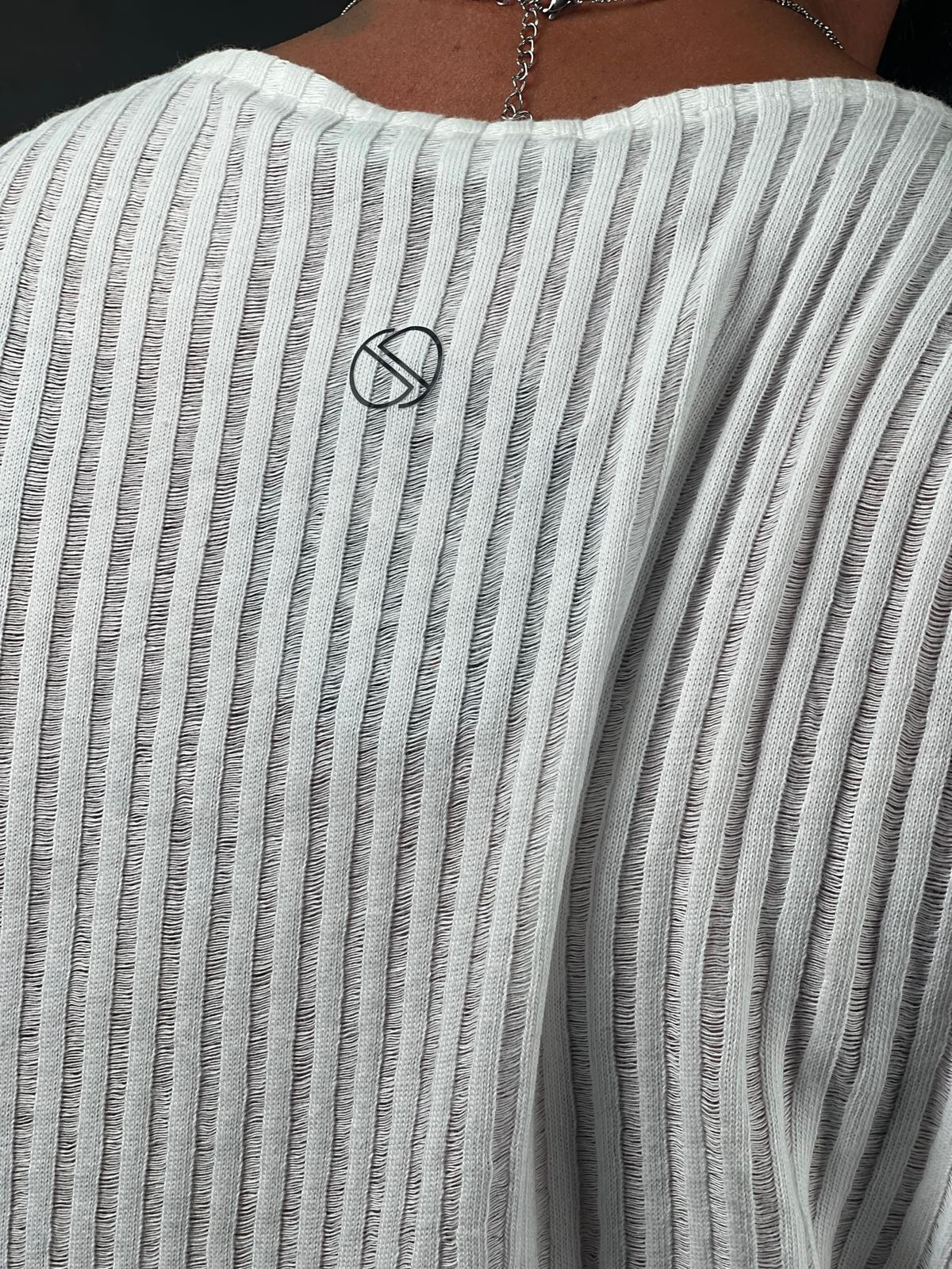 A shirt made from striped linen fabric, with an open collar and long sleeves.