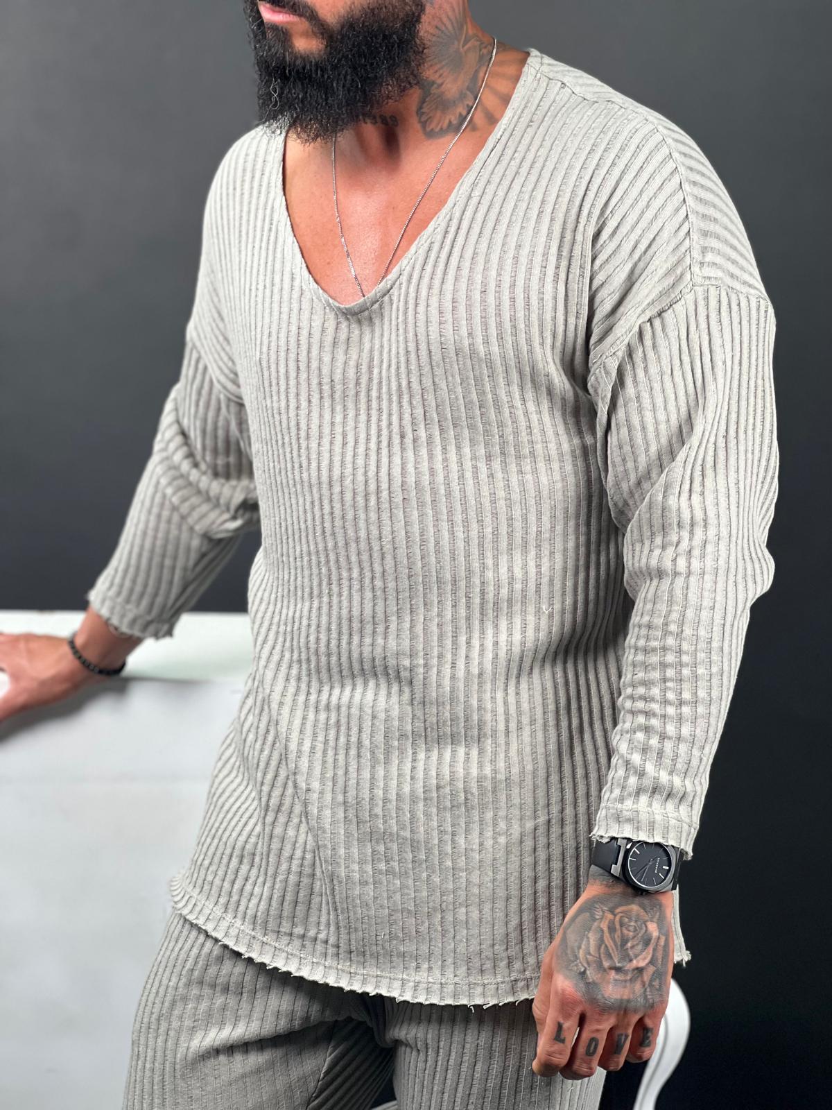 A shirt made from striped linen fabric, with an open collar and long sleeves.